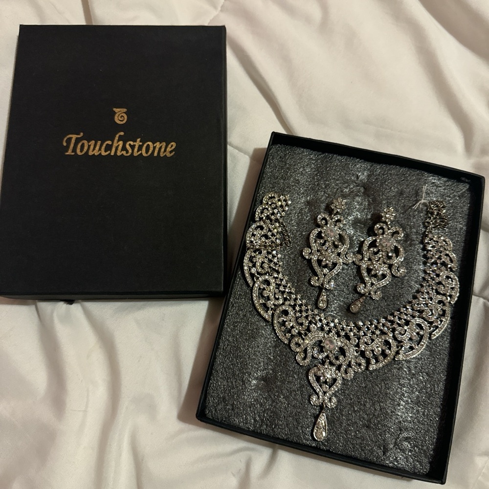 Silver earrings and necklace set still in packaging